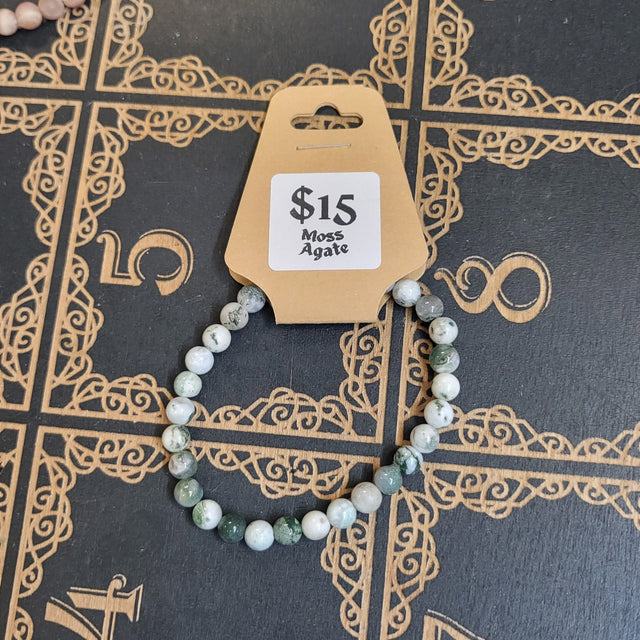 Bracelet with a price tag on a decorative black surface