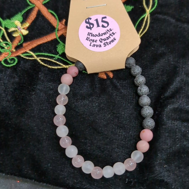 Beaded bracelet on a cardboard holder with a price tag on a textured surface