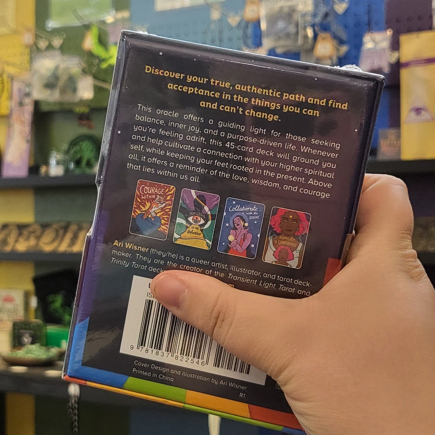 Hand holding a product with a colorful background