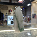 Crystal on a counter with a blurred store interior in the background