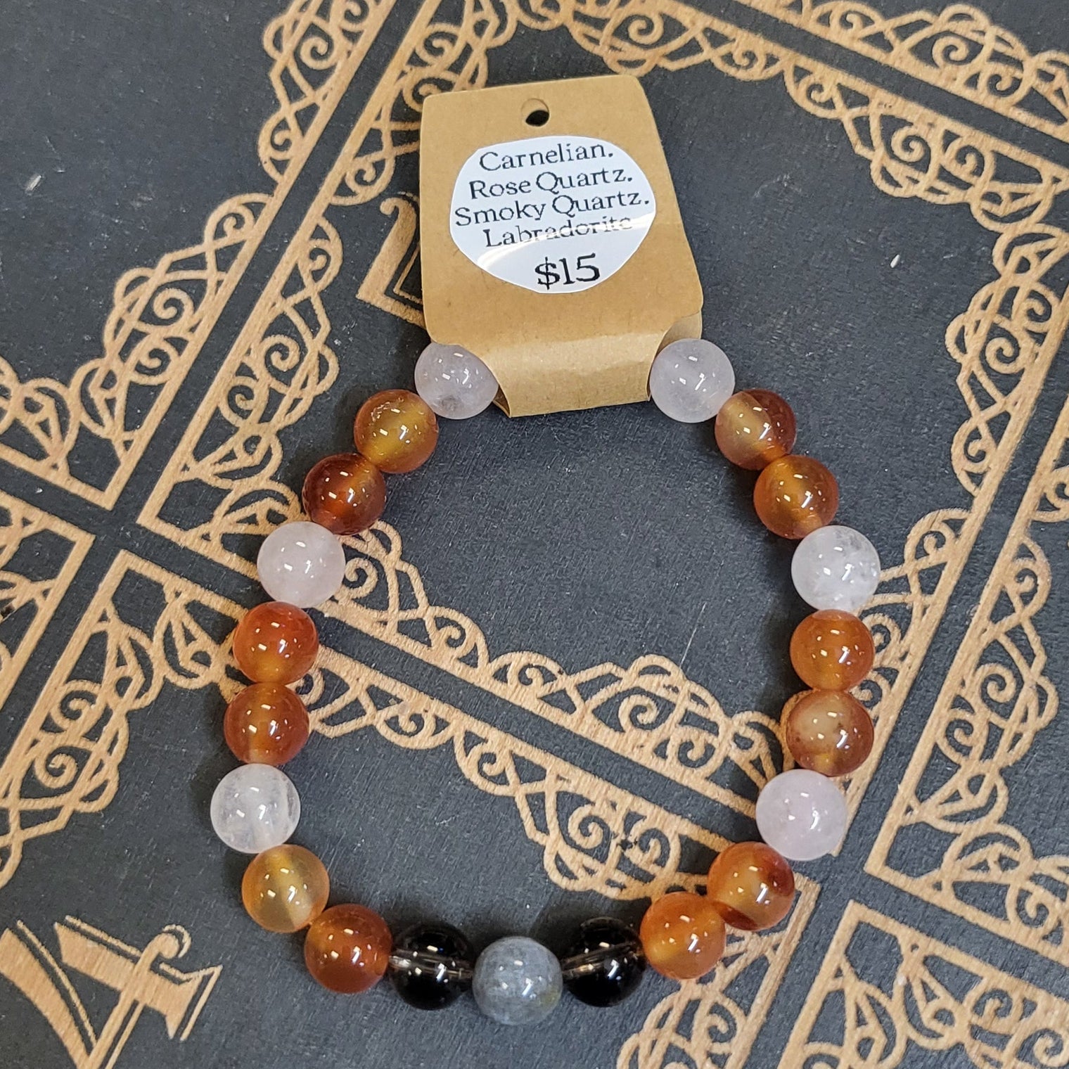 Bracelet with beads on a decorative book