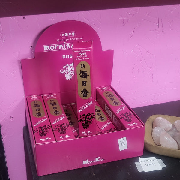 Product packaging on a reflective surface with a blurred background