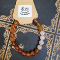 Beaded bracelet with a price tag on a decorative book